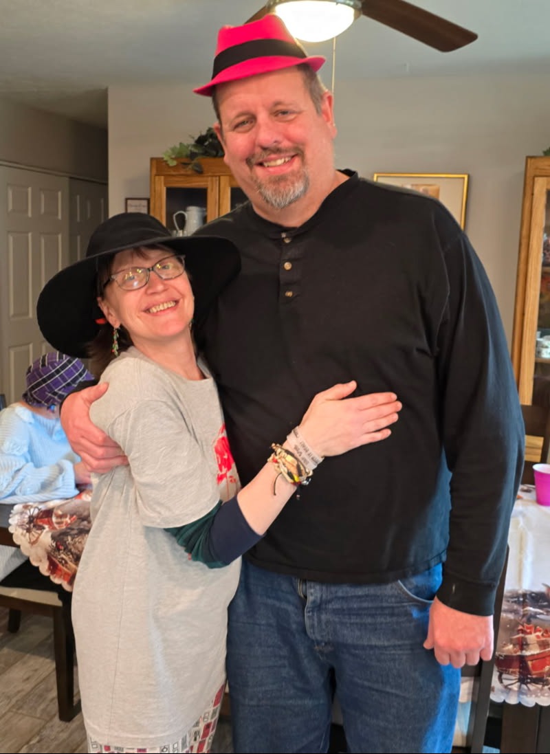 Corina and Geoff Embracing